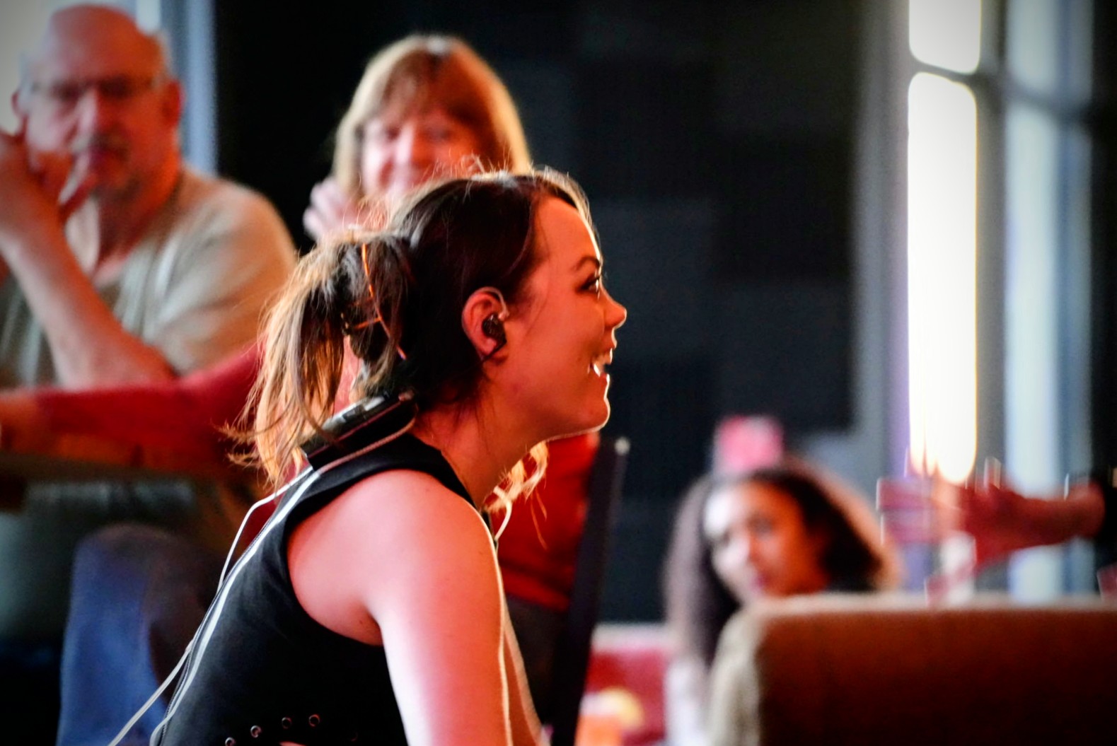 Female vocalist, close-up, warm crowd lighting